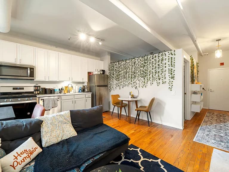 Living area opening into the kitchen at 6 East Monroe