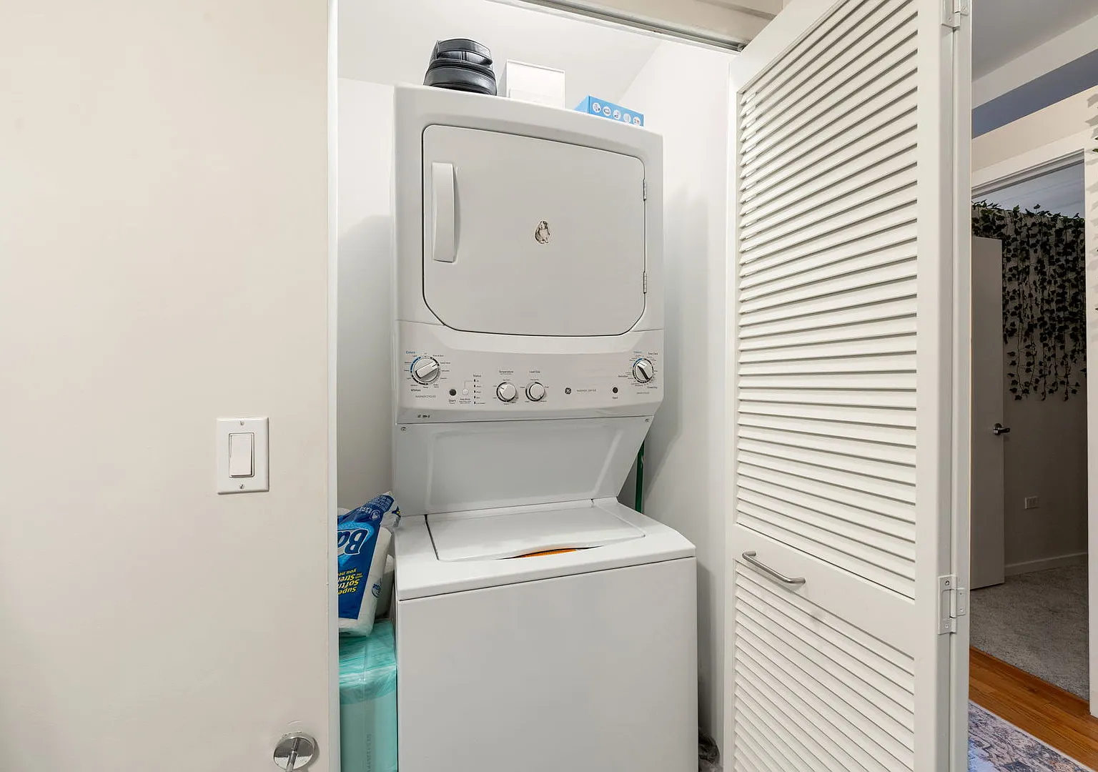 Stacked washer and dryer inside the condo